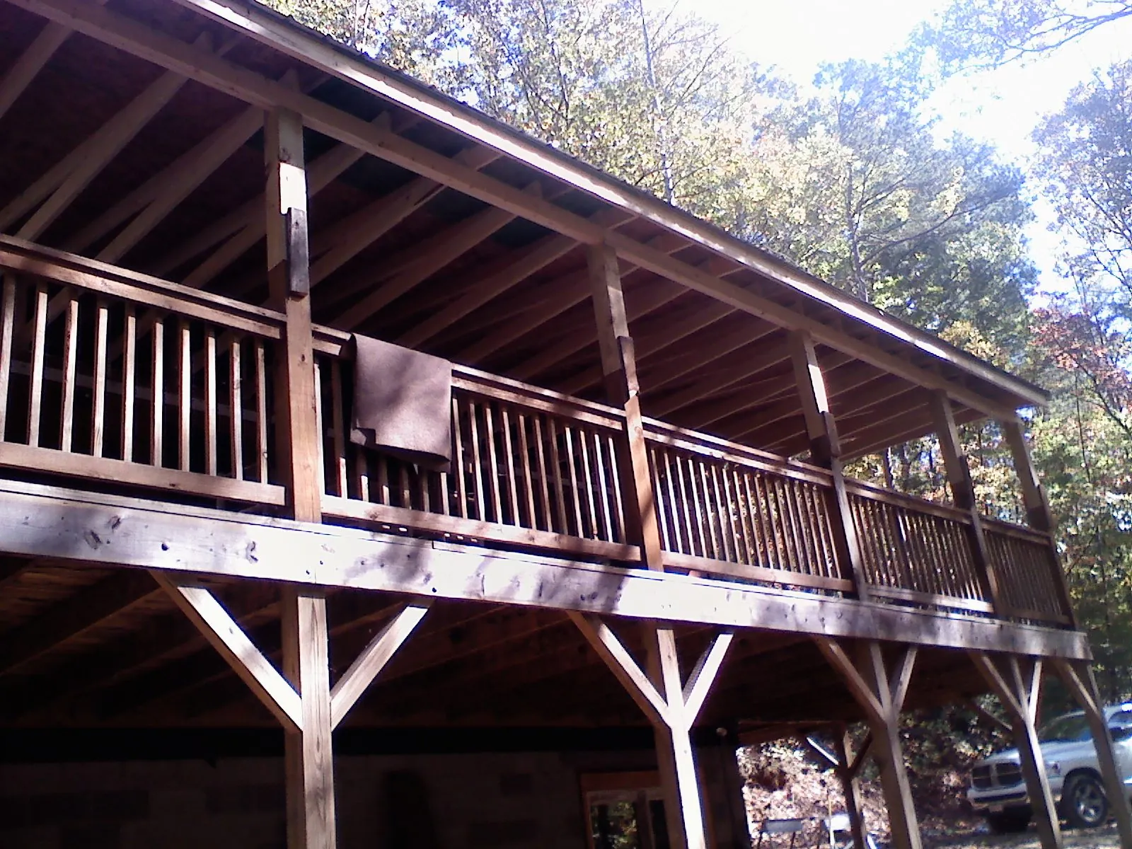 Timber framing under a new elevated porch and deck — Roof Leak Repair in New Madison by Roofing Brothers